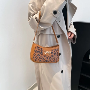 Chic leopard print underarm bag with silver bow buckle and adjustable strap