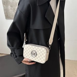 Retro monogram camera bag in cream leather with adjustable wide strap and metal M logo