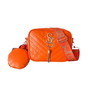 Orange quilted leather camera bag with wide strap and detachable round coin purse