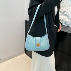 Light blue glitter shoulder bag for women with gold twist lock and elegant leather strap