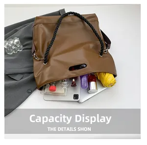 Brown leather tote bag interior showing large capacity for tablet, umbrella and water bottle
