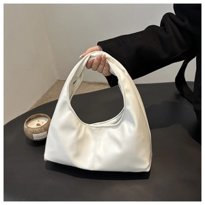 Detail of white half-moon hobo bag with smooth PU leather and vertical stitching accents