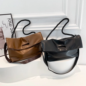 Minimalist large leather tote bag in black and brown with rope handles and wide strap