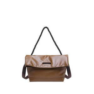 Minimalist tan PU leather tote bag with black braided handle and woven strap on white background
