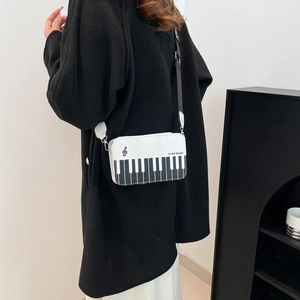 Minimalist piano keyboard crossbody bag for women with black and white music theme design