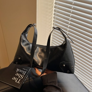 Vintage black underarm bag with silver rivets and adjustable shoulder strap for women