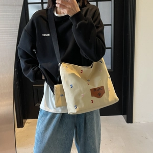 Large capacity off-white canvas tote bag with colorful J embroidery and mini pouch