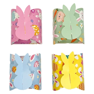 Set of four colorful Easter bunny paper gift boxes in pastel pink, green, blue and yellow