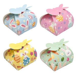 Close-up of four colorful Easter bunny candy boxes with rabbit ear lids and floral patterns