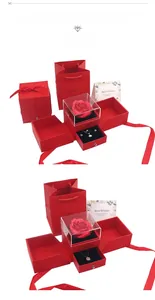 Macro shot of red double-door jewelry gift box with preserved roses and drawer detail