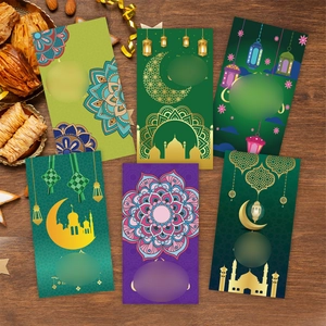 Set of 6 green Eid Mubarak money envelopes with mosque and moon designs on wood background