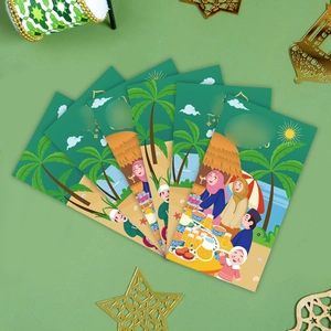 Detailed view of green Hari Raya money envelopes with cartoon illustration on beach
