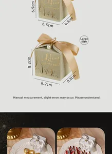Size comparison of glittery wedding favor boxes with satin bows and pearl charms