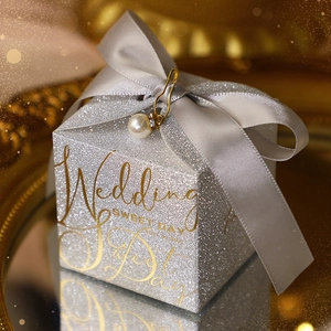Sparkling silver square wedding favor box with gold text and grey satin ribbon bow