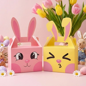 Scatole regalo coniglietto di Pasqua rosa e gialle con orecchie lunghe e faccine