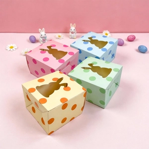 Detailed view of colorful Easter rabbit gift boxes with bunny shaped window and polka dots
