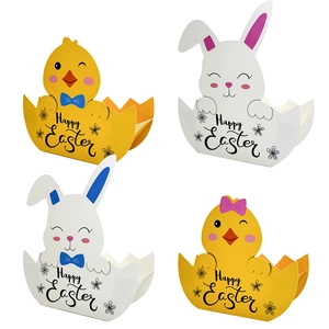 Detail of Easter egg-shaped paper gift boxes with chick and bunny designs and Happy Easter text