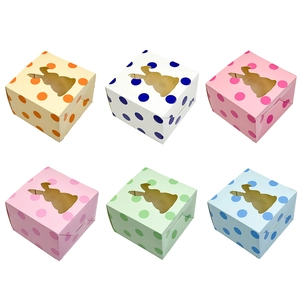 Close-up of Easter candy gift boxes with rabbit-shaped window and polka dot pattern