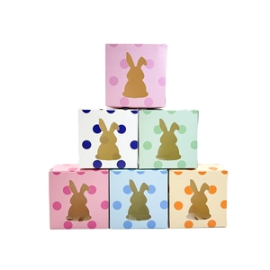 Detail showing six colorful polka dot Easter bunny gift boxes with hollow windows