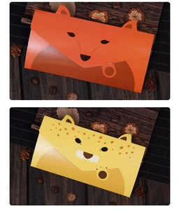 Detail of cute fox and leopard cartoon envelopes with 3D ears on dark wood background