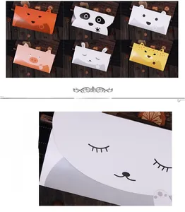 Detailed close-up of colorful cartoon animal envelopes featuring 3D ears and cardstock texture