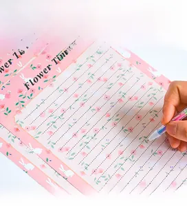 Detail view of floral pink stationery set with rabbit motifs and lined Flower Time paper