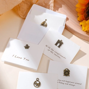 Vintage bronze alloy charms with greeting cards featuring sailboat crown and clock designs