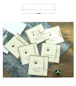 Set of 6 vintage handmade greeting cards with bronze metal pendants and twine bows