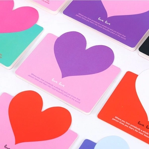 Colorful heart-shaped gift cards in assorted colors with creative patchwork design