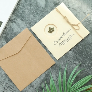 Vintage kraft paper greeting card set with envelope and bronze crown metal charm