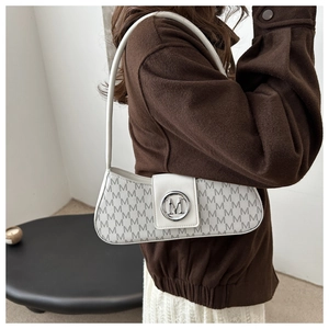 Detail of white baguette bag with grey M monogram and silver logo buckle on model