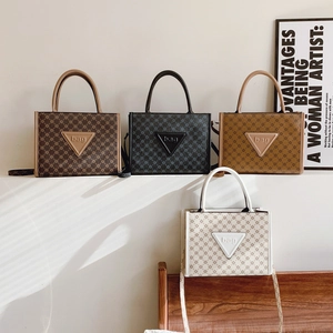 Large fashion tote bag with monogram print and four color options in spring style