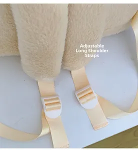 Detail of soft plush shoulder straps with adjustable plastic buckles on a white backpack