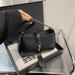 Retro black semi-circle hobo bag with glossy finish and golden hook buckle detail
