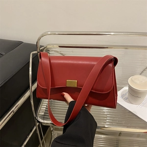 Classic red leather underarm bag for women with a rectangular shape and gold metal buckle