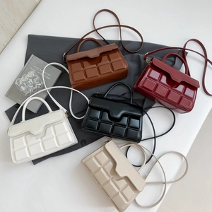 Minimalist square embossed handbag collection with single handle and crossbody strap