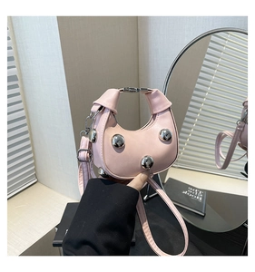 Pink heart-shaped mini bag with silver metal ball charm and crescent leather design