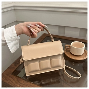 Detail of beige tote bag with unique 3D rectangular chocolate block texture