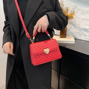 Retro red quilted crossbody bag with golden heart buckle and top handle for women