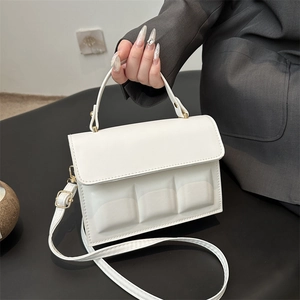 White minimalist square handbag with 3D chocolate relief blocks and top handle for women