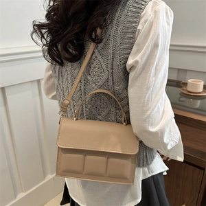 Beige chocolate-patterned shoulder bag with a square quilted texture and flap closure