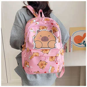 Close-up of pink backpack with cute Capybara cartoon patterns and large mascot patch