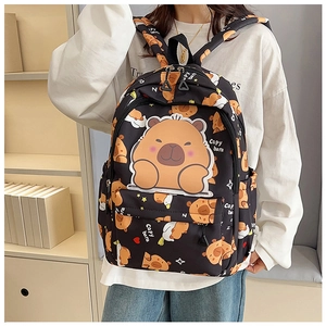Detail view of cute black capybara backpack with cartoon prints and adjustable shoulder straps