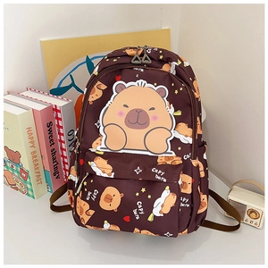 Detail of dark brown backpack featuring cute cartoon capybara prints and star patterns