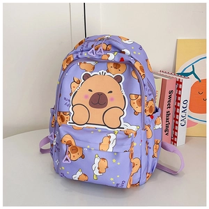 Detailed close-up of a purple school backpack featuring cute cartoon capybara print and patches