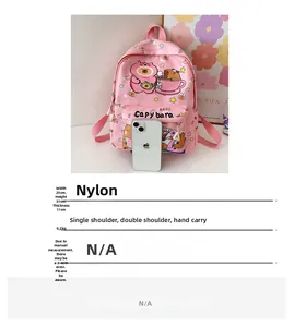 Detail of pink cartoon backpack showing 0.2kg weight and 25x31x11cm dimensions