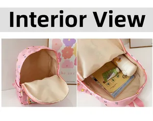 Detailed interior of pink cartoon schoolbag showing spacious main compartment for kids