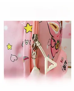 Close-up of pink cartoon backpack featuring a durable smooth dual metal zipper system