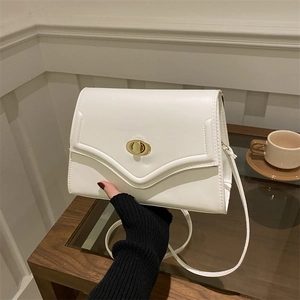 Chic white square crossbody bag with gold metal twist lock and slim shoulder strap