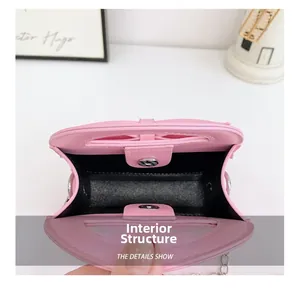 Internal view of pink bow toddler handbag with magnetic buckle and black lining